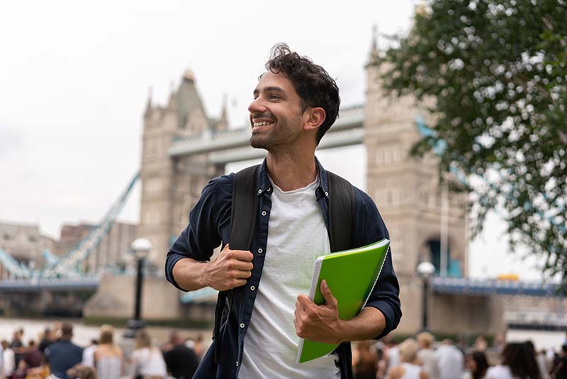 student holding book