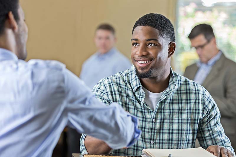 Student speaking with advisor