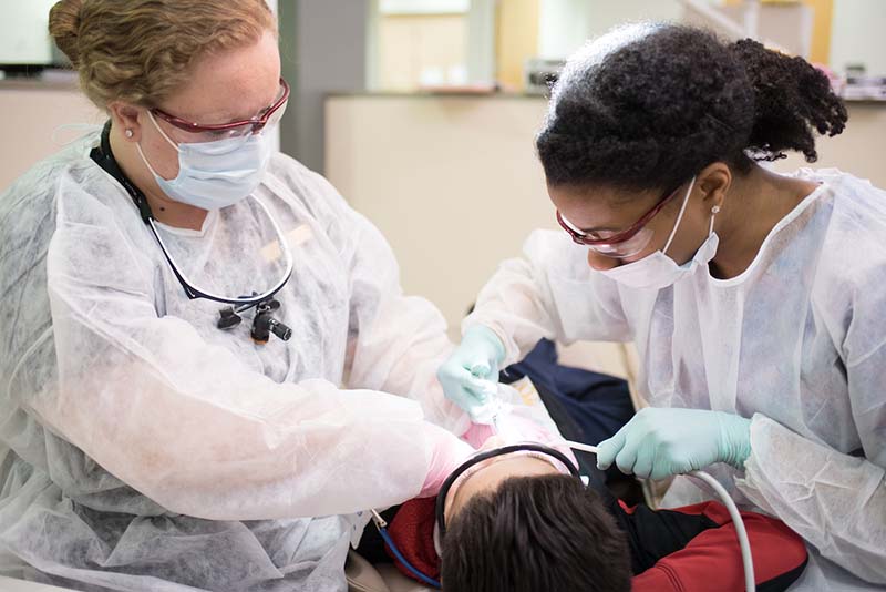 Students performing surgical operation